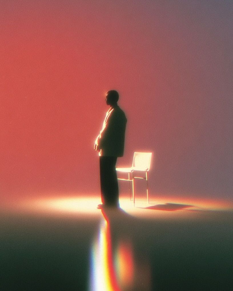 A man standing next to a glowing chair
